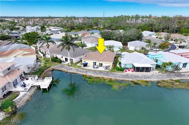 aerial view with a water view and a residential view