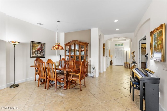 dining space featuring light tile patterned floors