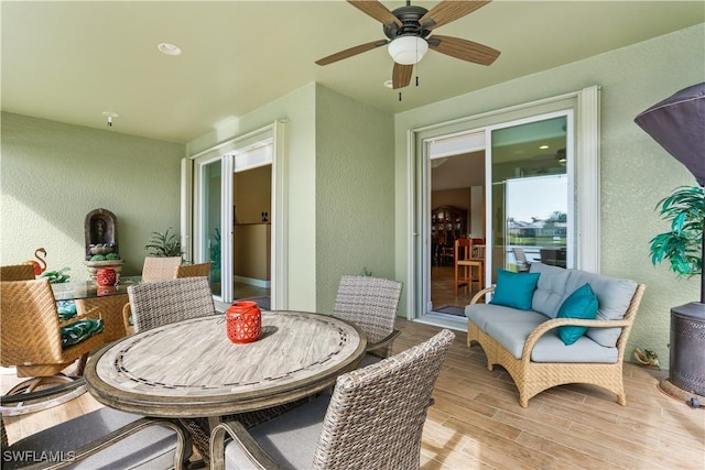 exterior space featuring a wood stove and ceiling fan