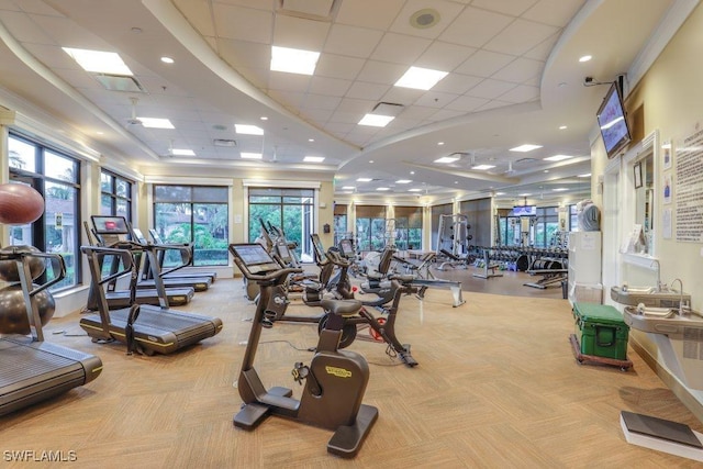 workout area with light carpet and a drop ceiling