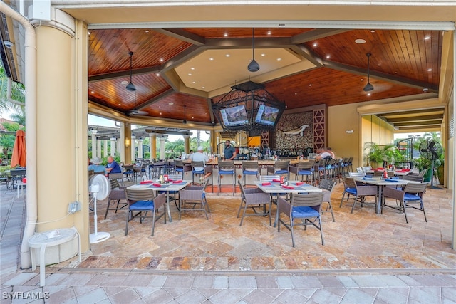 dining space with beamed ceiling, high vaulted ceiling, and wooden ceiling