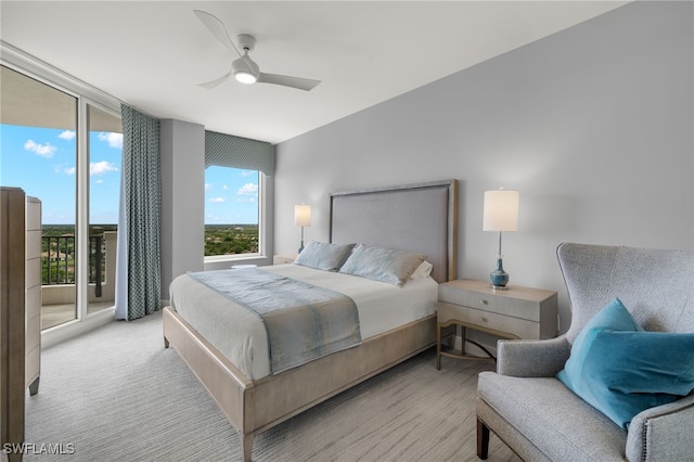 carpeted bedroom featuring ceiling fan and access to exterior