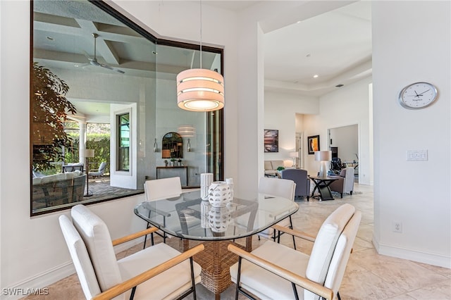 dining area featuring a high ceiling