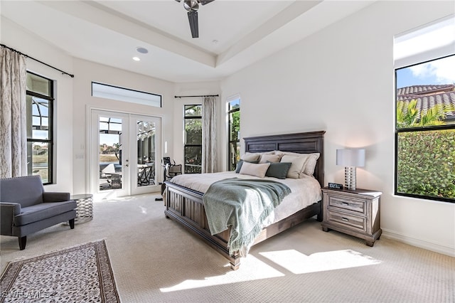 bedroom with light colored carpet, access to exterior, and french doors