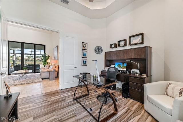 office featuring a high ceiling