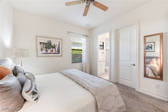 carpeted bedroom featuring ensuite bathroom and ceiling fan