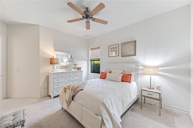 bedroom with light carpet and ceiling fan