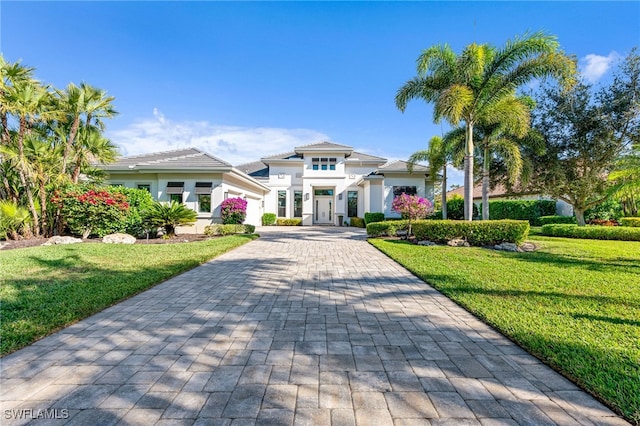 mediterranean / spanish-style house with a front yard