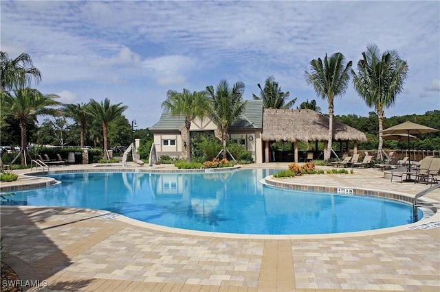 view of swimming pool with a patio area