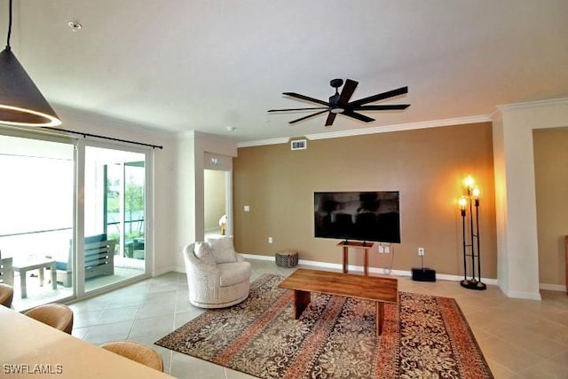 living room with ornamental molding, light tile patterned floors, and ceiling fan