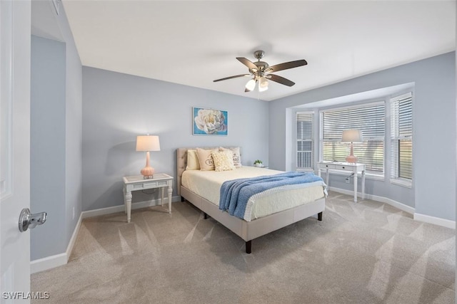 bedroom with ceiling fan and carpet floors