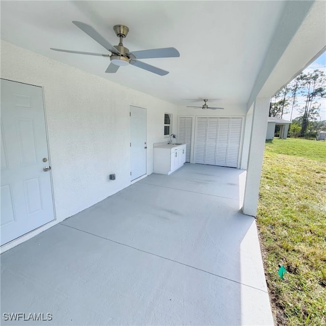 view of patio featuring sink and ceiling fan