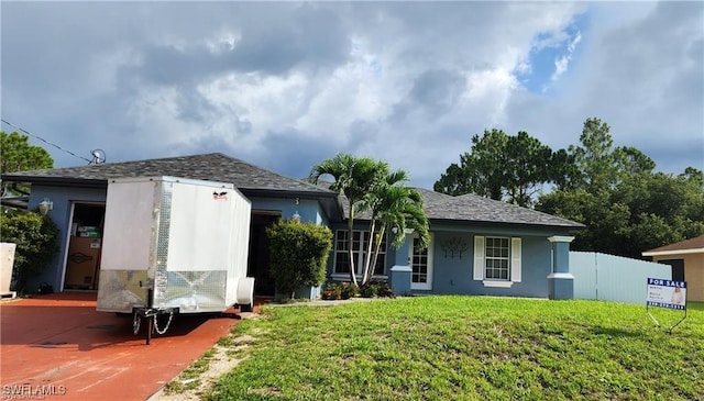 view of front of home with a front lawn