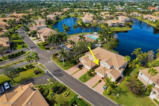 birds eye view of property with a water view