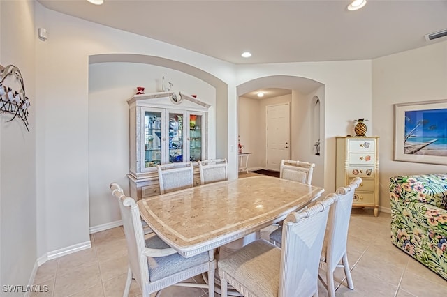 dining area featuring light tile patterned flooring