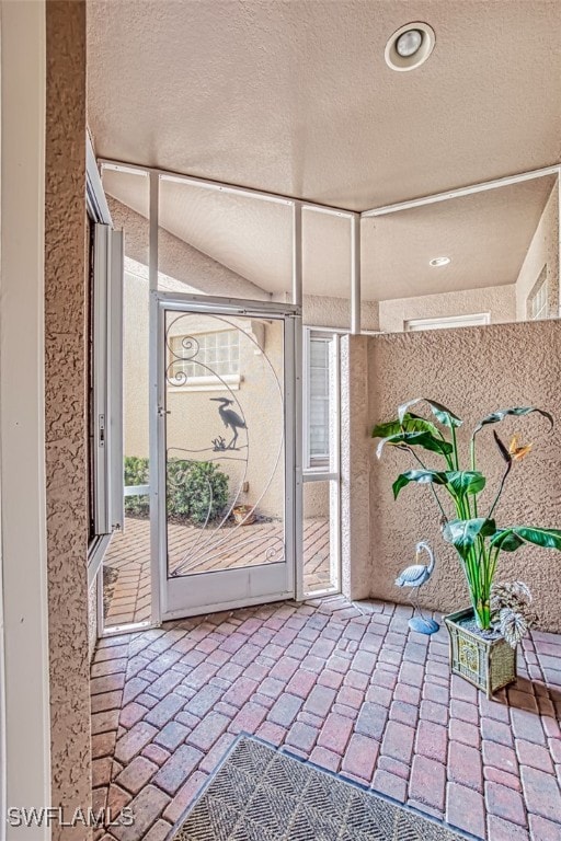 interior space with a textured ceiling