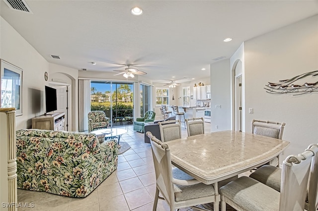 dining room featuring ceiling fan and light tile patterned flooring