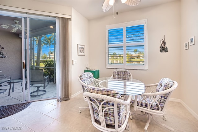 tiled dining area with ceiling fan