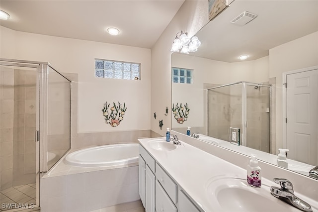 bathroom featuring vanity, tile patterned flooring, and independent shower and bath