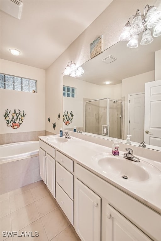 bathroom featuring tile patterned flooring, plus walk in shower, and vanity