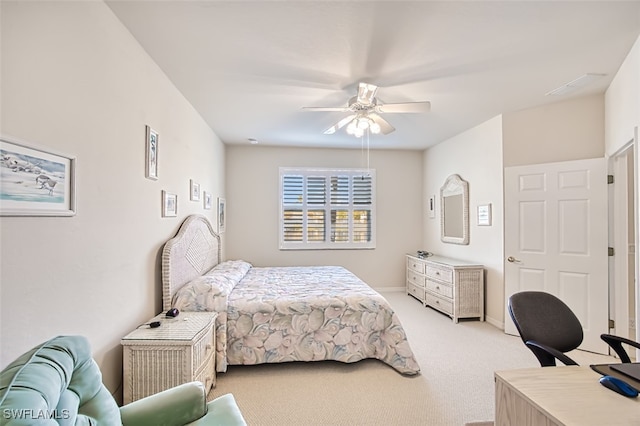 bedroom with light colored carpet and ceiling fan