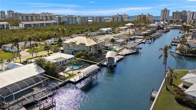 drone / aerial view with a water view and a city view