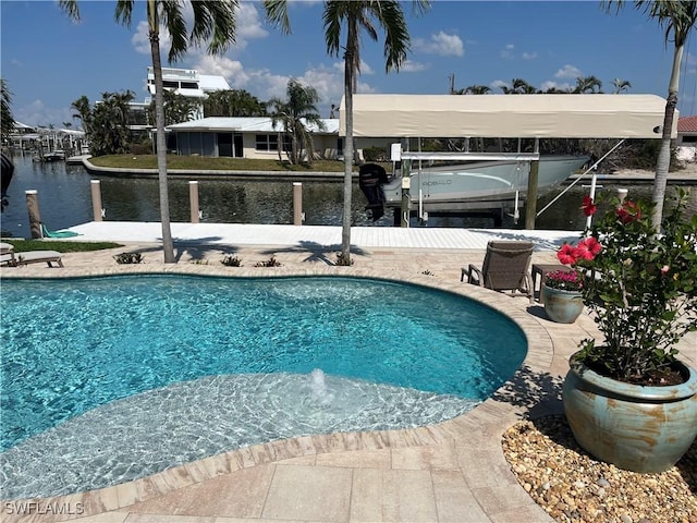 pool with a water view, a boat dock, and boat lift