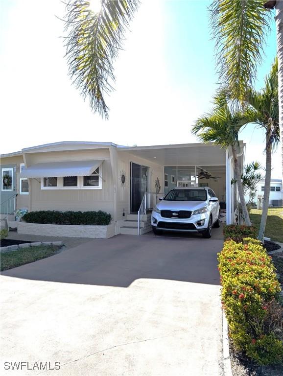 view of front of house featuring a carport