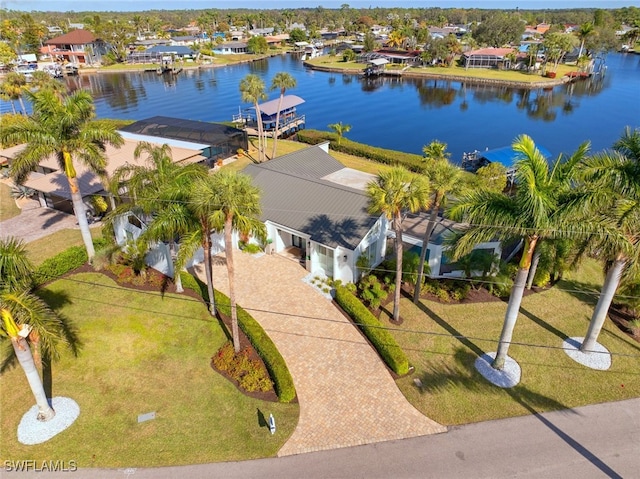 birds eye view of property with a water view