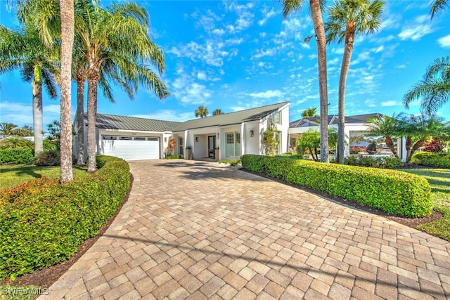 view of front of home with a garage