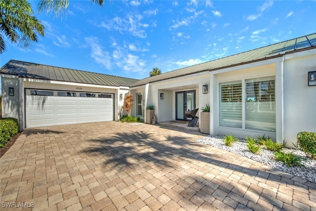 ranch-style home featuring a garage