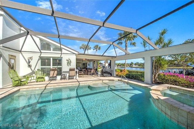 view of swimming pool with a water view, an in ground hot tub, a lanai, and a patio