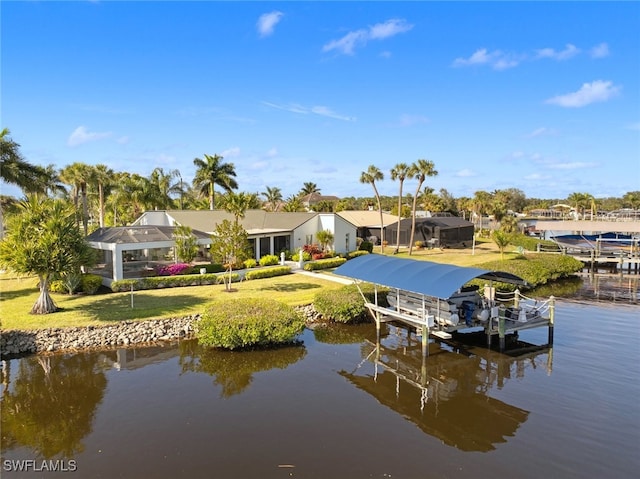 dock area featuring a lanai, a lawn, and a water view