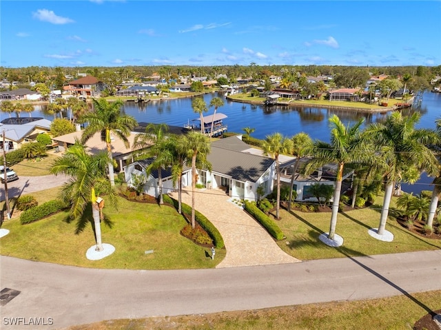 birds eye view of property with a water view