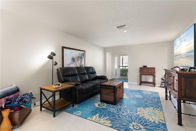 living room with a textured ceiling