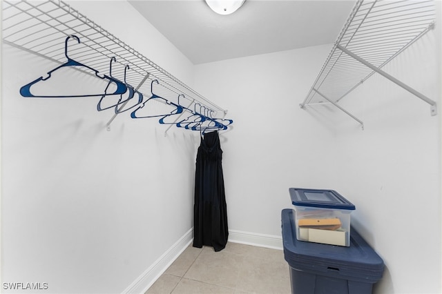 spacious closet with tile patterned floors