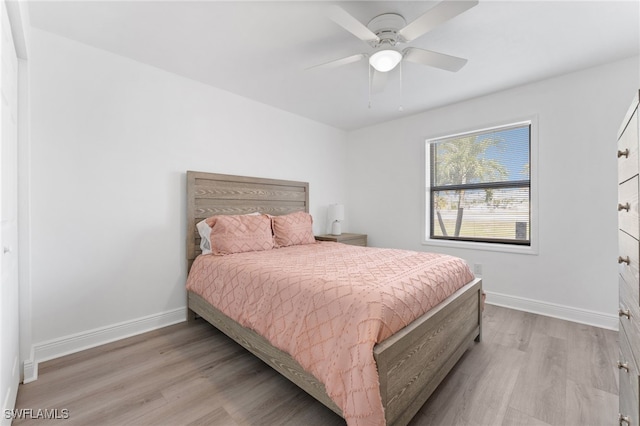 bedroom featuring light wood-type flooring and ceiling fan