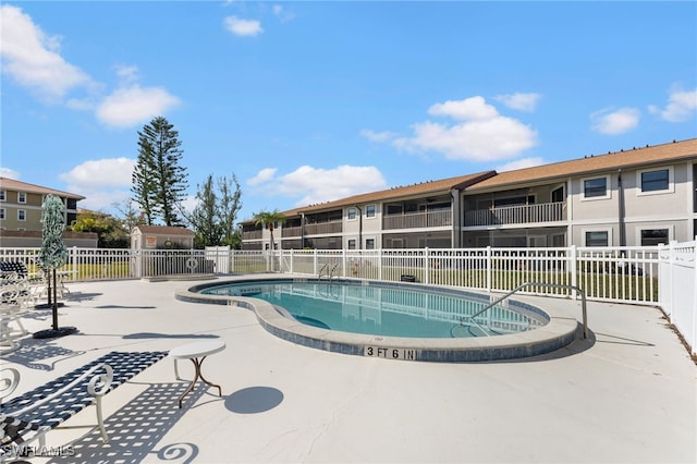 view of pool featuring a patio area