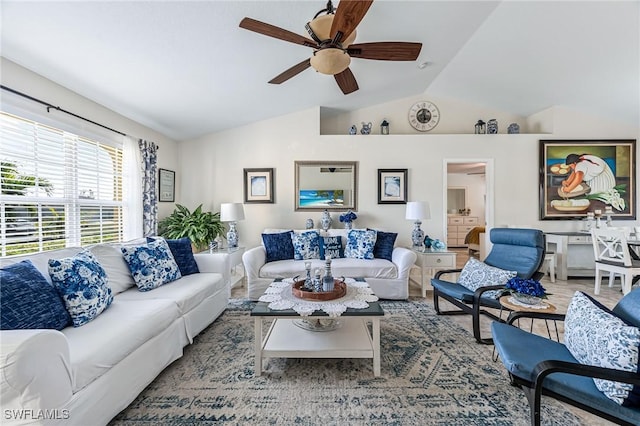 living room featuring vaulted ceiling and ceiling fan