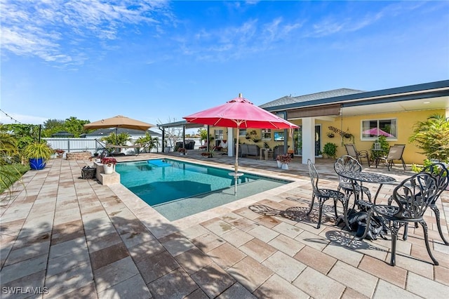 view of swimming pool featuring a patio area