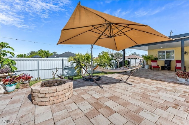 view of patio / terrace featuring a fire pit