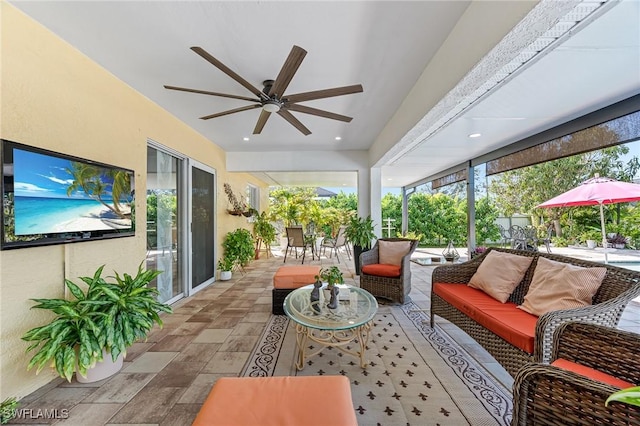 sunroom / solarium with ceiling fan