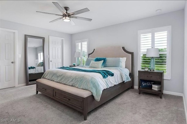 carpeted bedroom featuring ceiling fan