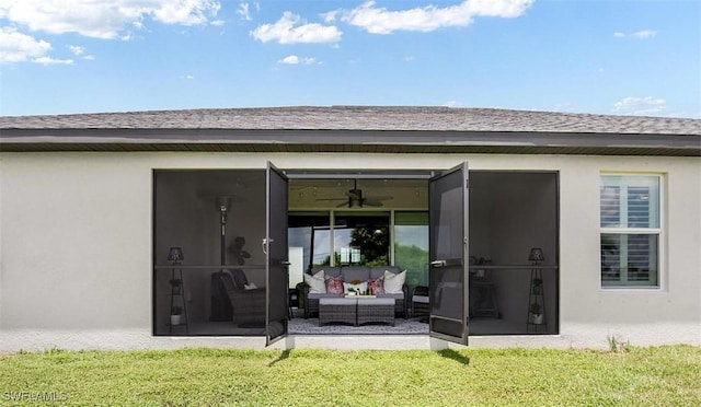 rear view of property featuring an outdoor hangout area, a patio area, ceiling fan, and a lawn