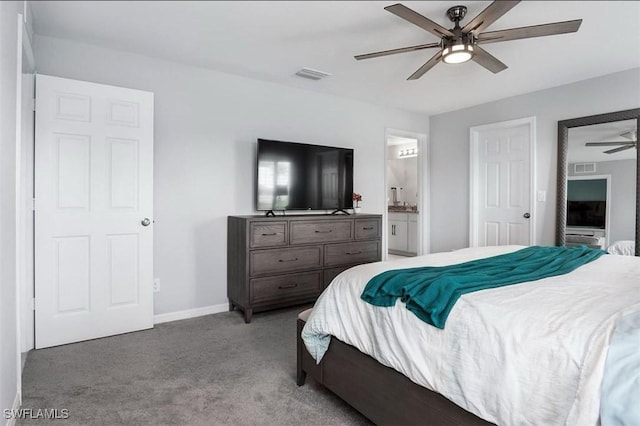 carpeted bedroom with ceiling fan and ensuite bathroom