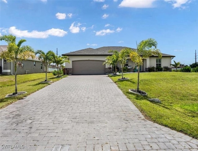 single story home featuring a garage and a front lawn