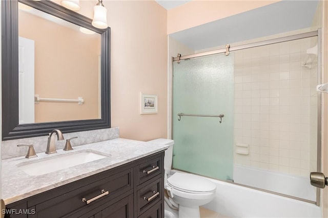 full bathroom with vanity, combined bath / shower with glass door, and toilet