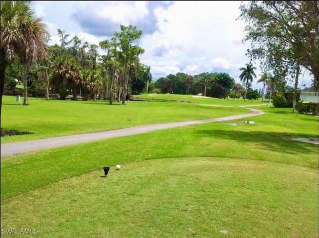 view of home's community featuring a lawn