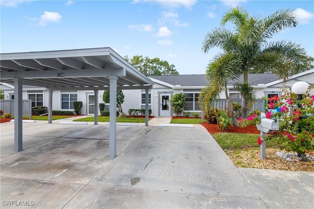 exterior space featuring a carport