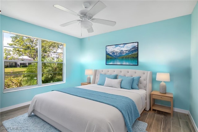 bedroom featuring ceiling fan and hardwood / wood-style floors